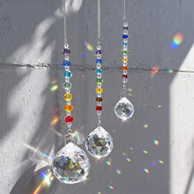 HDCRYSTALGIFTS 3 crystal prism suncatchers catching sunlight to cast rainbows