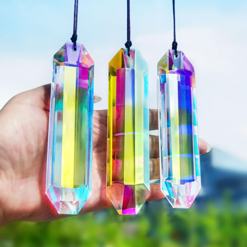 HDCRYSTALGIFTS 5-inch AB sun catcher prism catching sunlight to reveal rainbows.