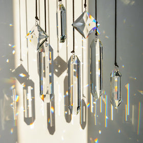 HDCRYSTALGIFTS crystal prisms suncatcher decorating the kitchen with gentle sparkle.