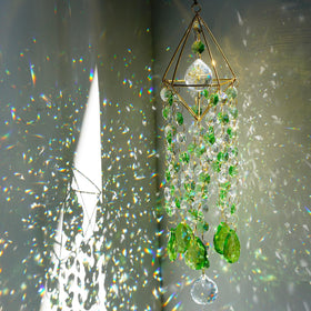 HDCRYSTALGIFTS crystal suncatcher with green rainbow prisms brightening windows