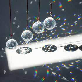 HDCRYSTALGIFTS rainbow-suncatcher-prism adds vibrant color when hung in a sunny window