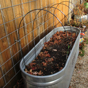 Hdeoops frost cloth setup over raised beds supports early germination protection