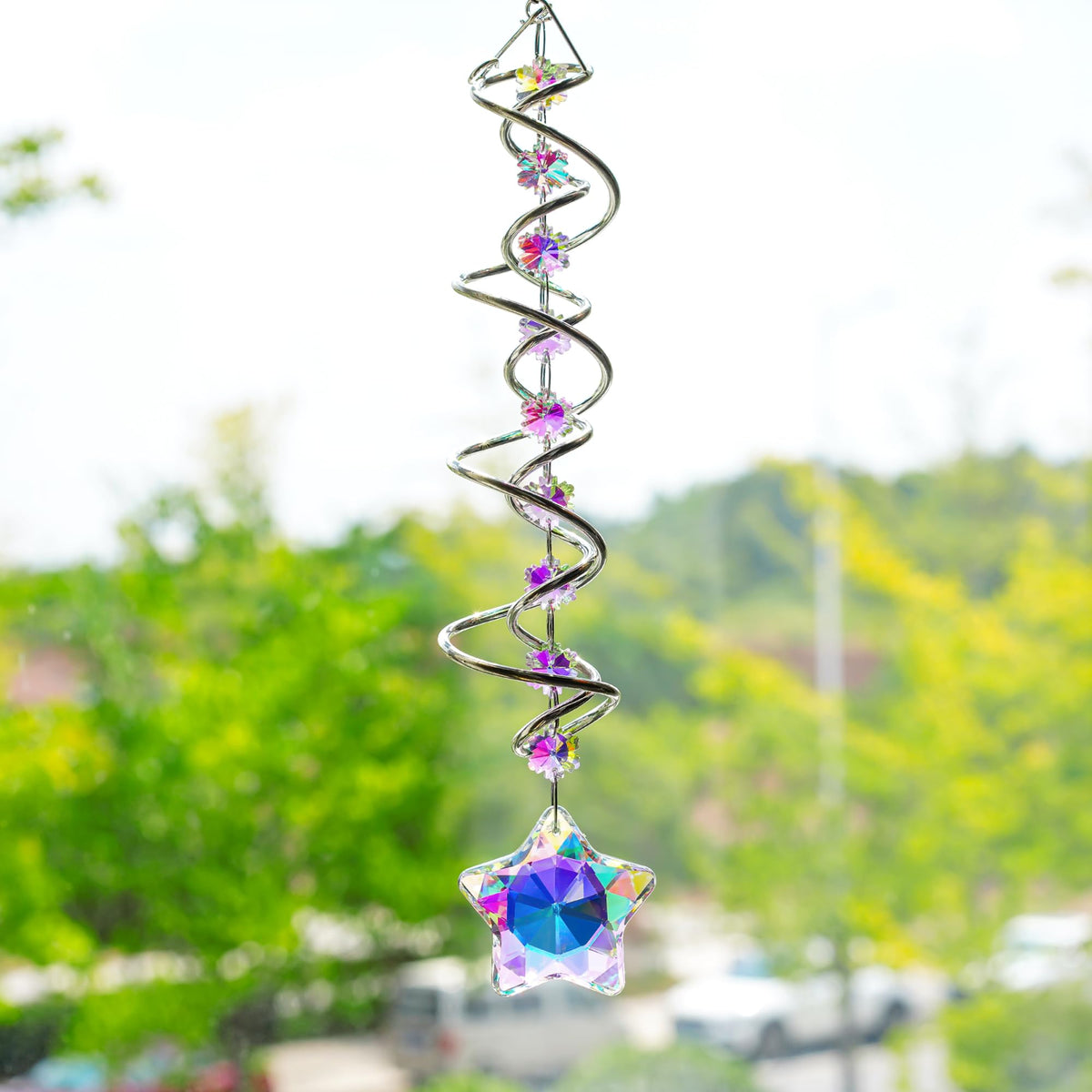 H&D Hyaline & Dora crystal suncatcher with star prism and beads adds sparkle to a Christmas display