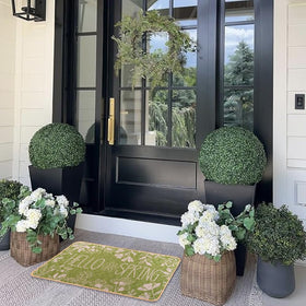 Heirloom Haven Hello Spring mat illustrating easy cleaning with hose or wipe