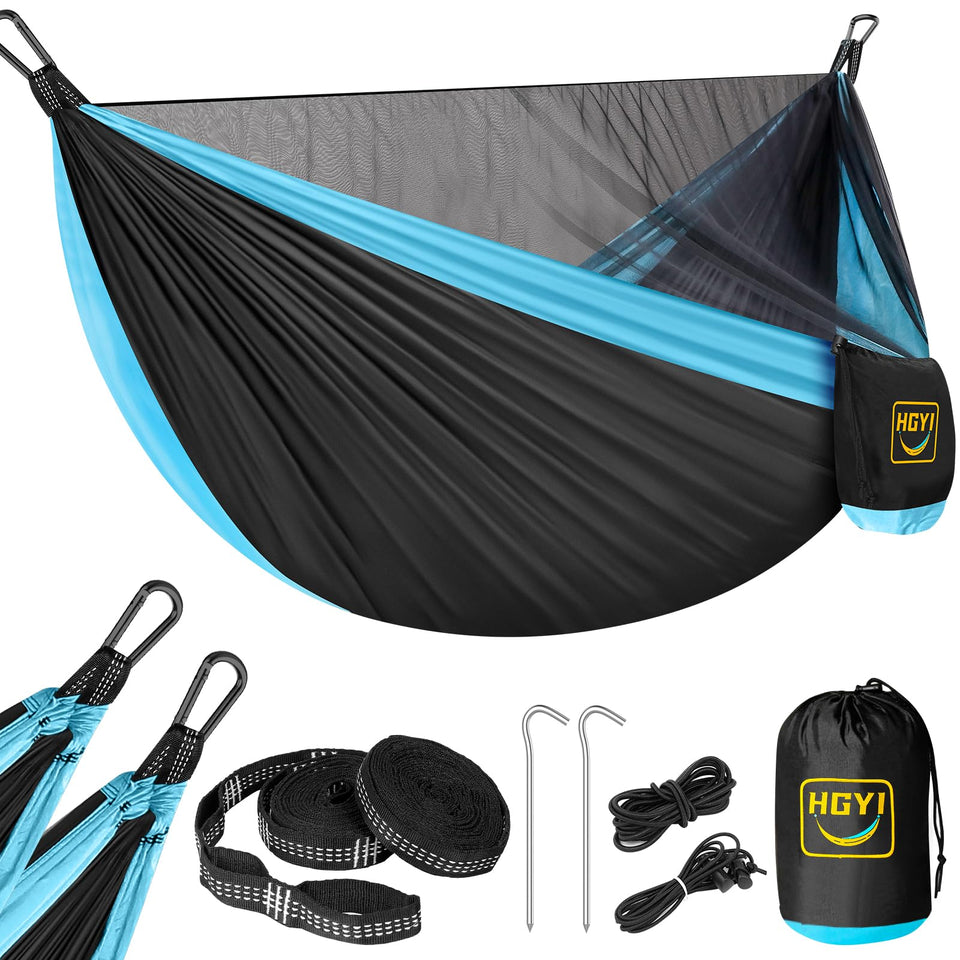 HGYI camping hammock with mosquito net setup between trees for insect-free comfort.