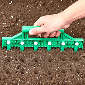 HHTHH seed dibber with handle and pins for precise spacing.