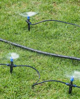 HIRALIY 50 ft main hose supporting multi-zone garden irrigation.