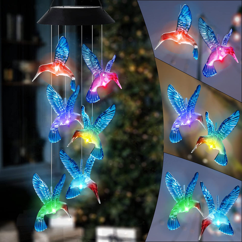 HiSolar hummingbird solar wind chimes with blue glow lighting your garden at night