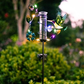 HOBYLUBY hummingbird rain gauge LED lights illuminate pathways after dusk.