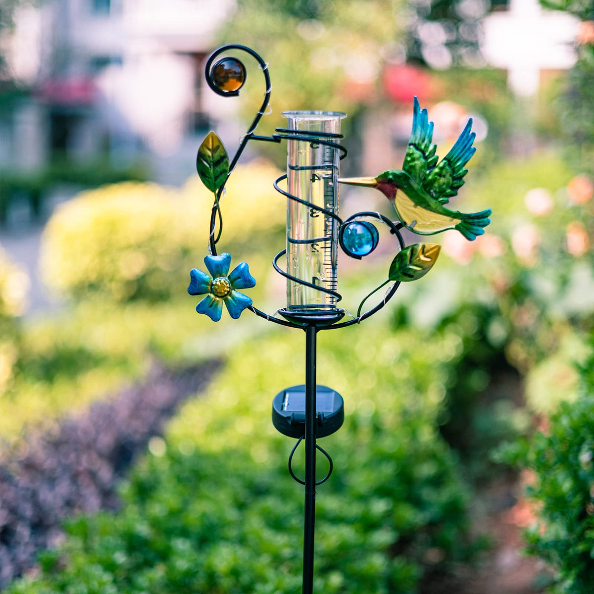 HOBYLUBY hummingbird rain gauge solar panel charges during day for night glow.