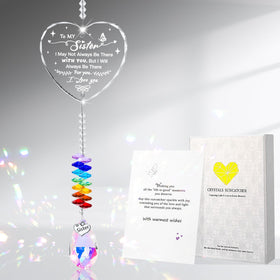 Hoemwarm crystal suncatcher heart prism catching sunlight to create gentle rainbows.