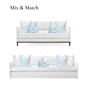 Hofdeco Premium 20x20 cover styled on outdoor furniture adding light airy charm