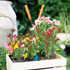 Hogardeck weatherproof garden stakes create height and texture along paths.
