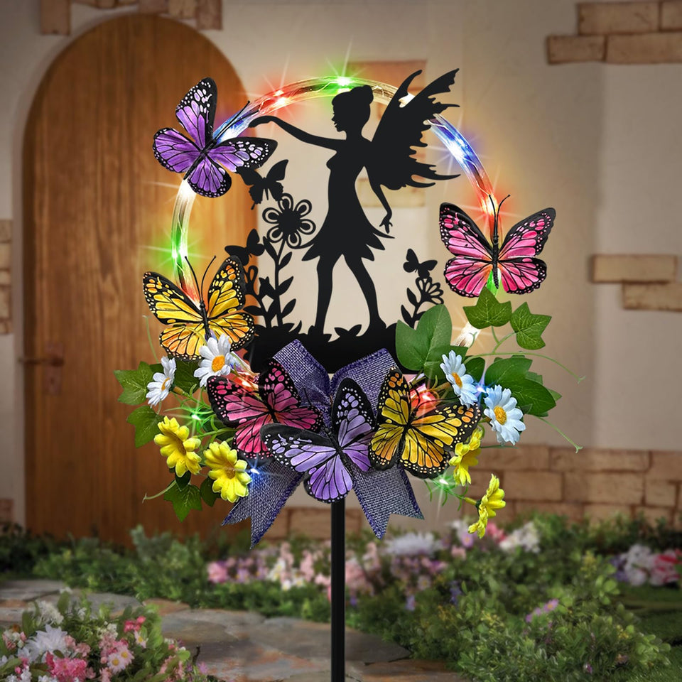 Hokfirm solar fairy garden stake with silhouette and butterflies lighting walkways at night.