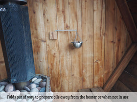 Home Sauna Experience swinging arm holds diffused scent over rocks for even diffusion