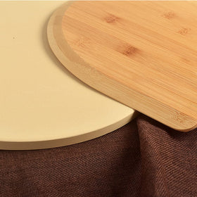 homEdge bamboo pizza peel board ready to slide pizzas.