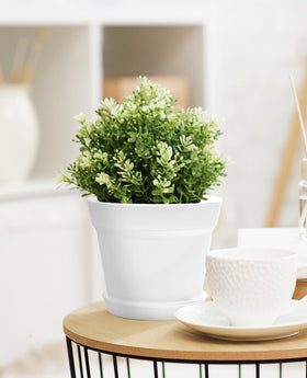 Homenote planters on a sunny windowsill for bright indoor displays.