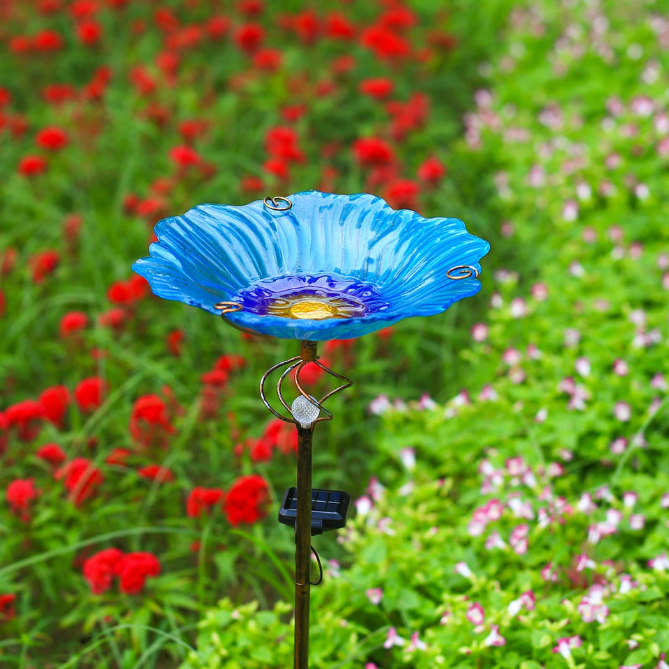 Homight solar glass blue bird bath glowing at night to brighten your yard.