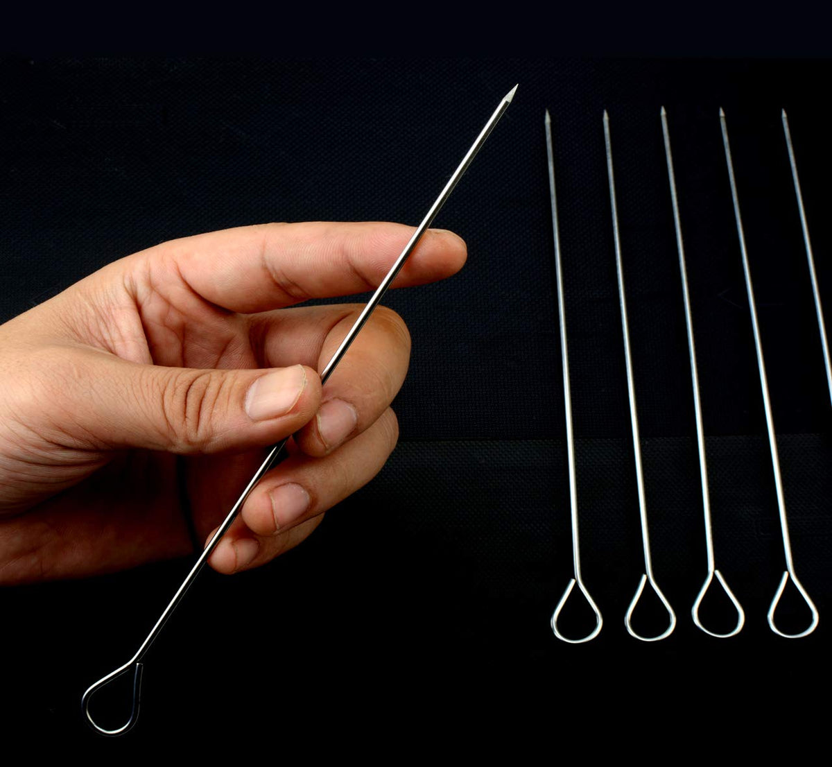 HONSHEN kabob skewers with ring-tip handles for easy grip.