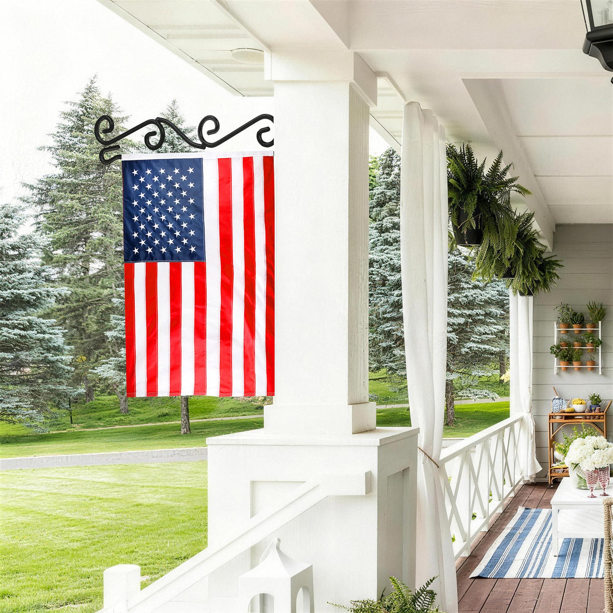 HOOSUN garden flag scroll hanger on a porch railing enabling easy flag swaps.
