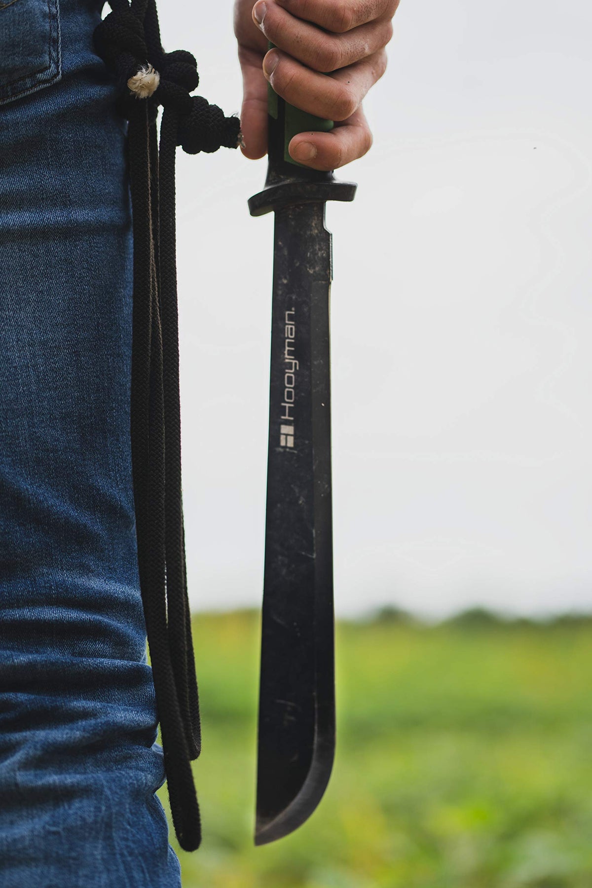 Hooyman bush machete in woodland demonstrates versatile field cutting in dense brush.