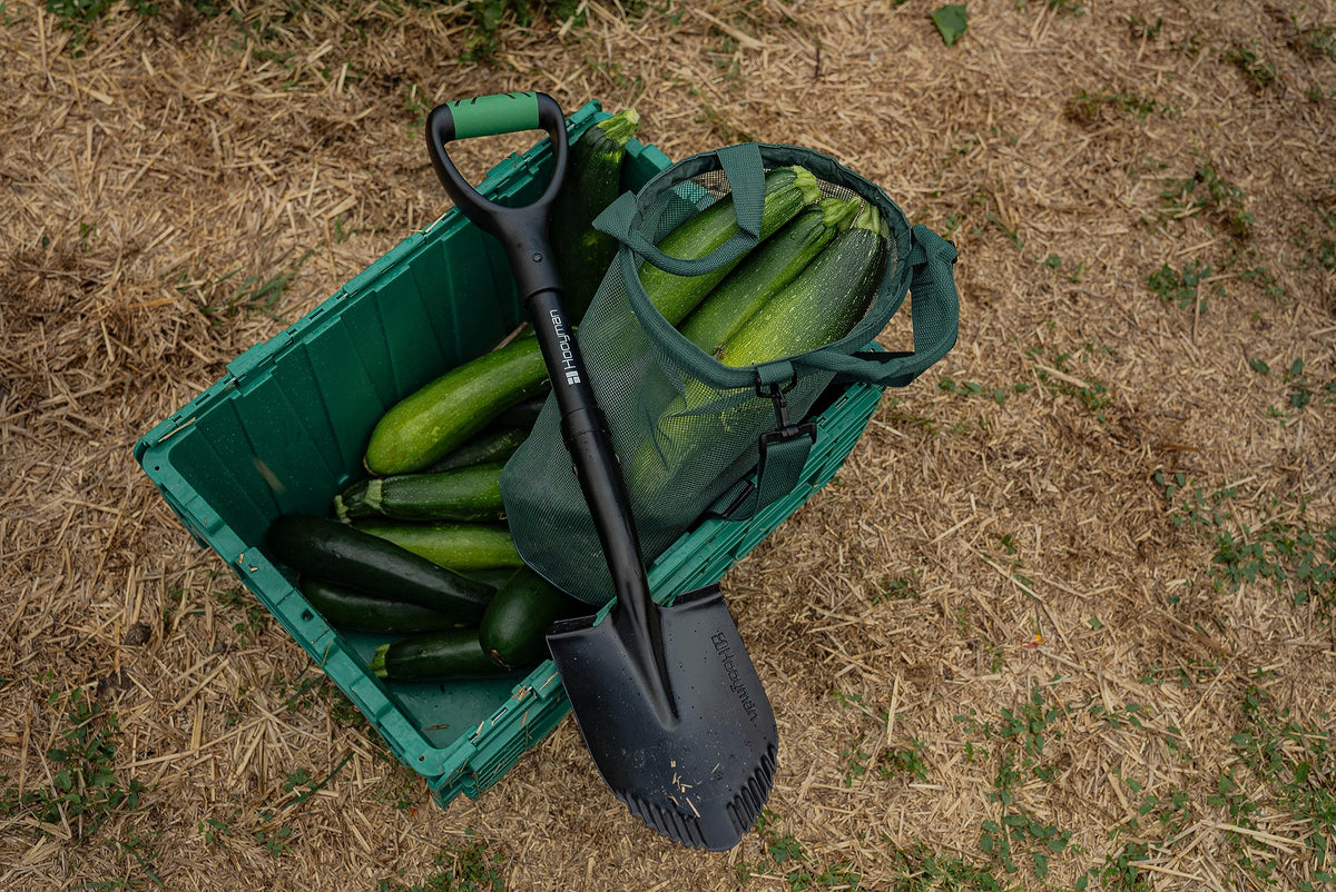 Hooyman mini digging shovel serrated blade cuts through roots and rocks.
