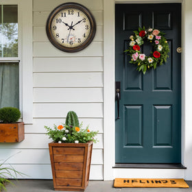 Horizent bronze wall clock side view showing rugged waterproof build for garden spaces.