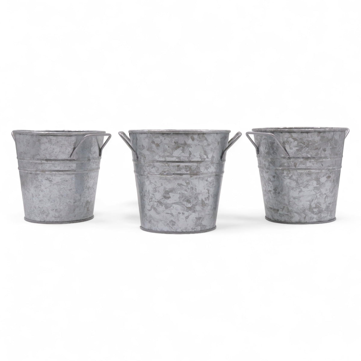 Hosley galvanized planters set of 3 on tabletop with liners for indoor display.