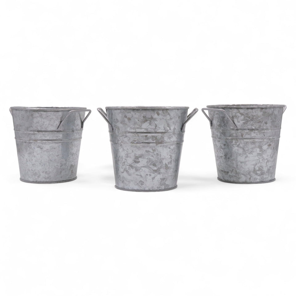 Hosley galvanized planters set of 3 on tabletop with liners for indoor display.