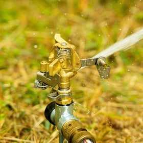 Hourleey sprinkler installed in a garden lawn setup for efficient irrigation