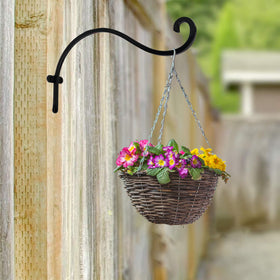 Hourleey bracket mounted on wooden fence post for garden displays.