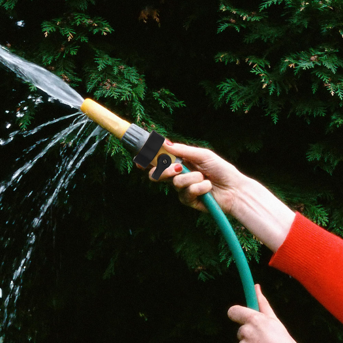 Hourleey installation-ready valve shown attached to garden hose system
