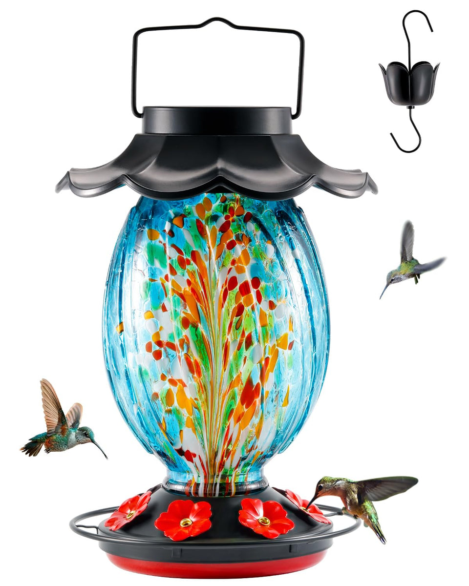 HouseSapp solar hummingbird feeder with blue glass reservoir attracts hummingbirds outdoors.