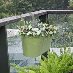 HowRU green metal planters add decorative garden accents.