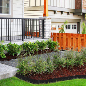 Hugeleaf garden-bed edging neatly defines flower beds to keep soil contained.