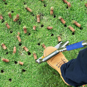 hugeneroy manual push core aerator 3-tines demonstrates deep core creation for better drainage