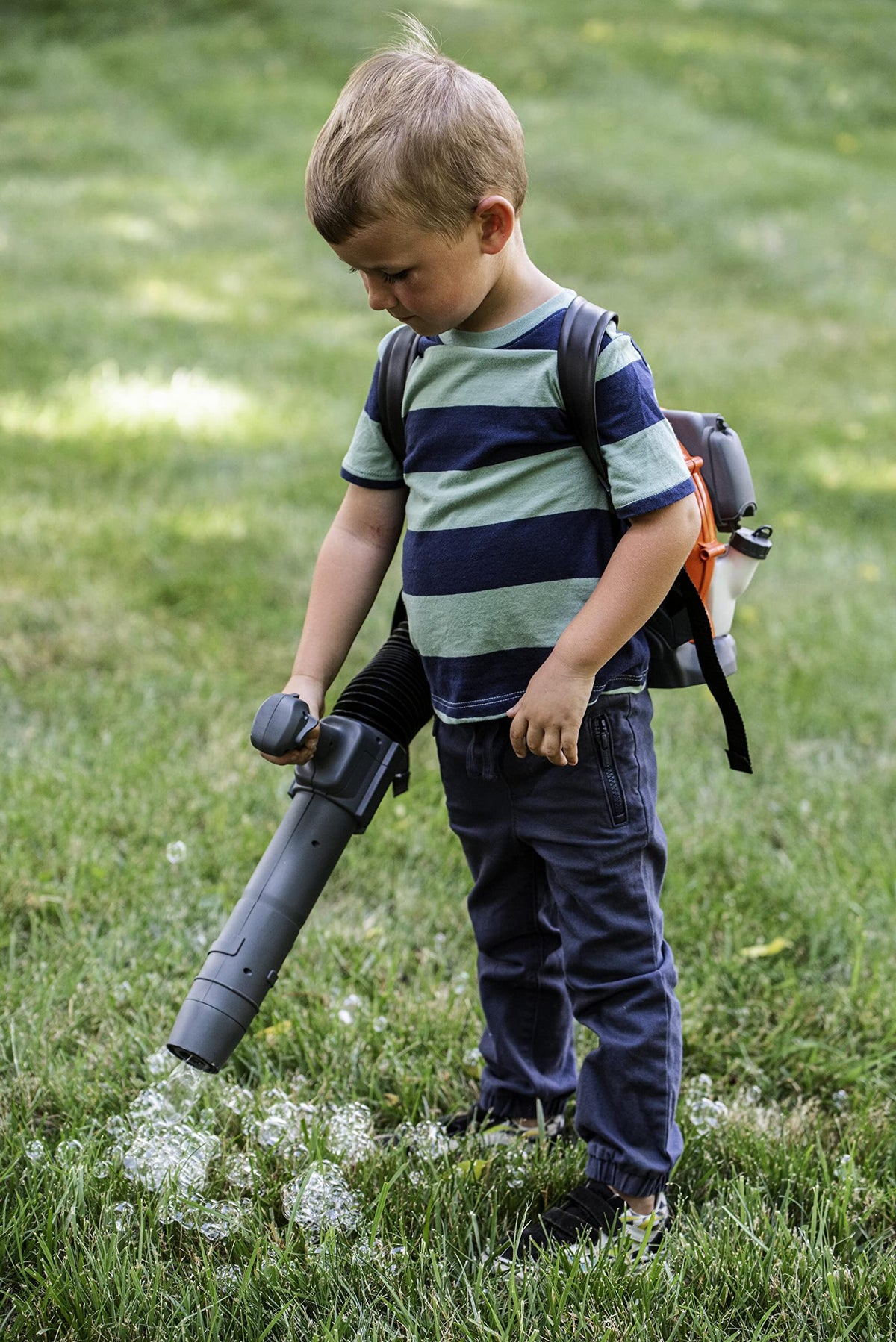 Husqvarna 150BT toy leaf blower demonstrates pretend air flow with visible streamers.