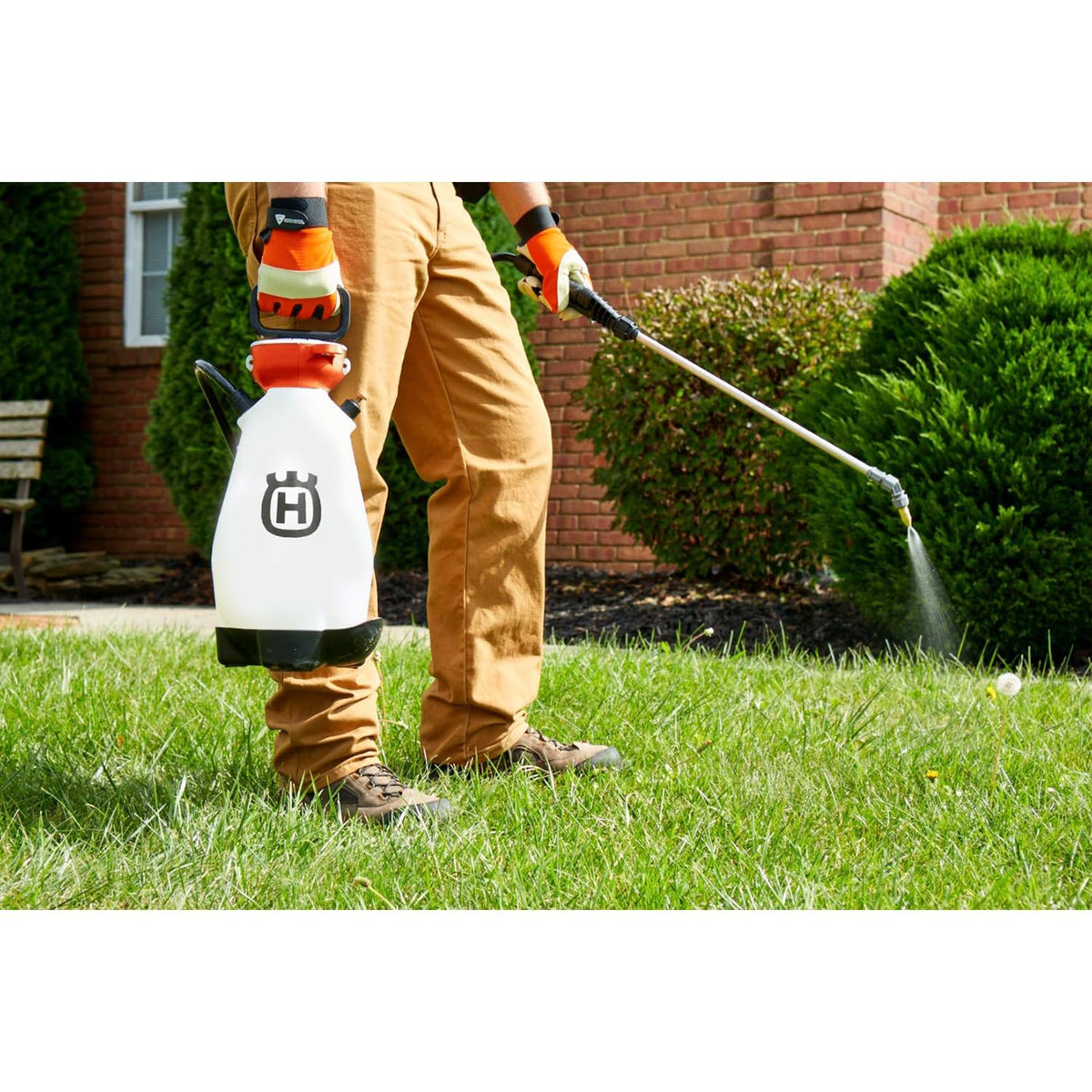 Husqvarna 2-Gallon handheld sprayer nozzle enables controlled application.