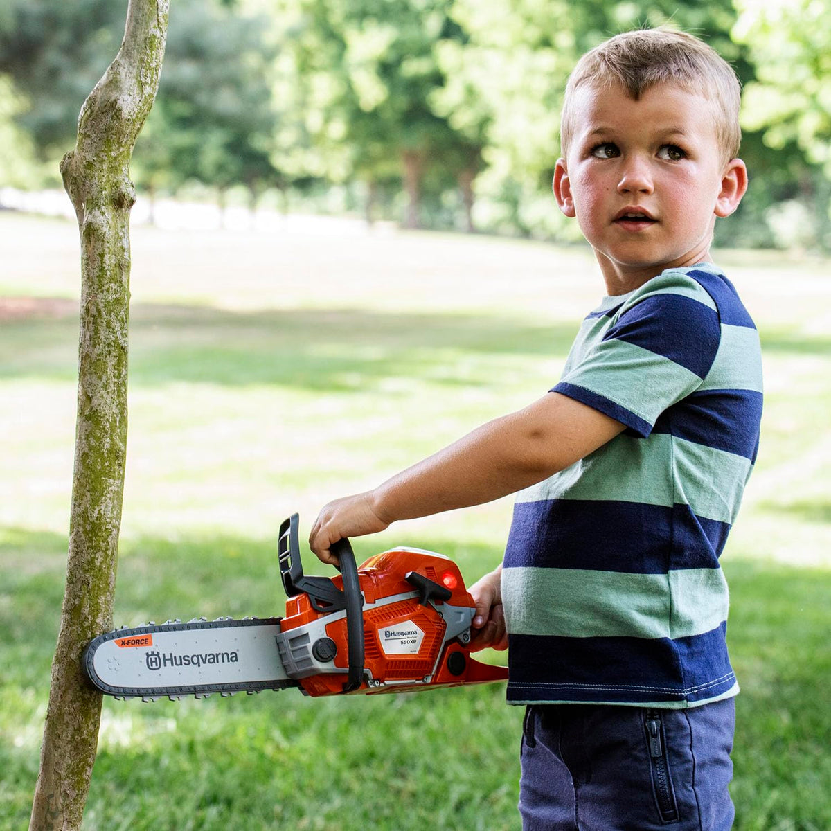 Husqvarna 550XP toy chainsaw requires 3 AA batteries (not included).