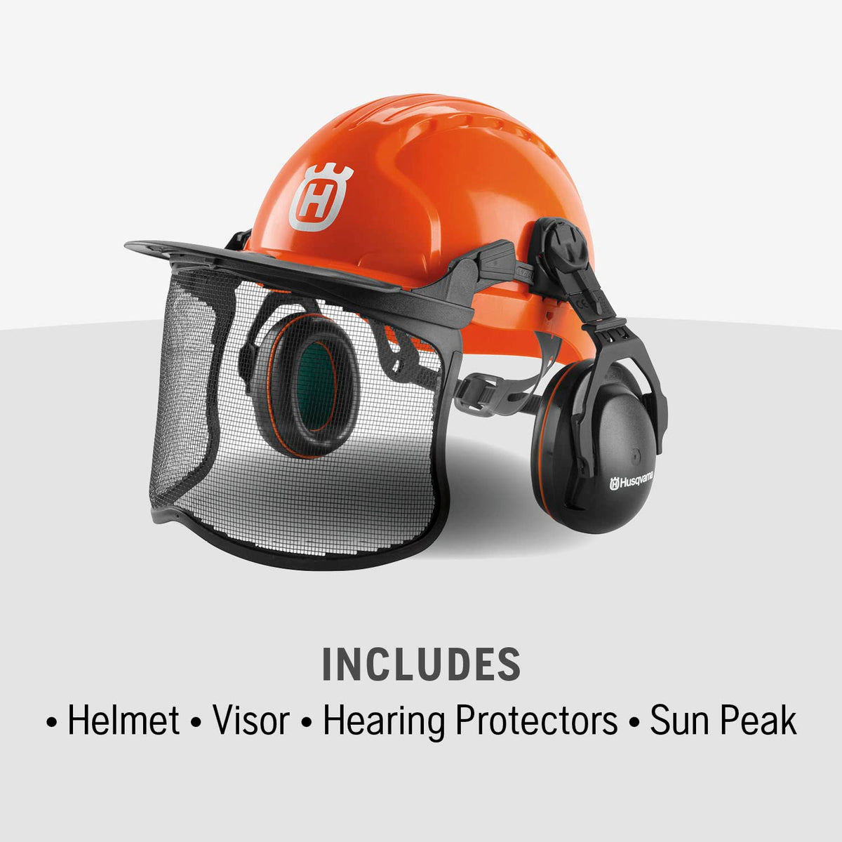 Husqvarna forestry helmet with sun peak shielding sun and debris.