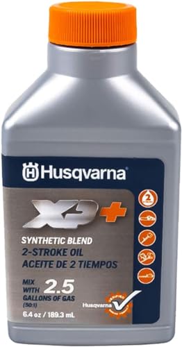 Measuring cup with Husqvarna XP oil for precise fuel mixing