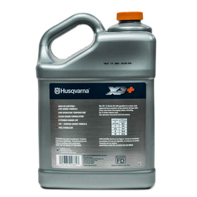 Husqvarna XP+ oil label closeup showing certified formulation for cleaner engine operation.