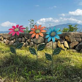 HUTHDAK colorful yard art creates welcoming curb appeal along borders and pathways.
