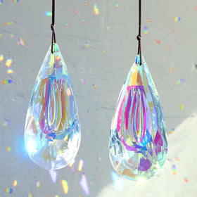 HYBEADS AB-coated prism suncatcher casts colorful rainbows in sunlight.