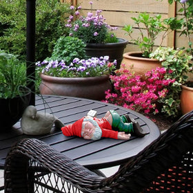 IcyAits cute garden dwarf gnome serves as a whimsical desk or shelf ornament.