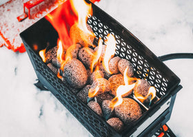 Ignik FireCan lava stones creating ambient flames for cozy outdoor gatherings