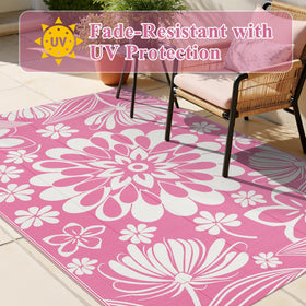 Ileading portable rug with a carry bag for easy transport.