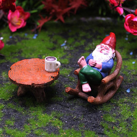 Inkaove garden gnome relaxing in a recliner for cozy outdoor spaces