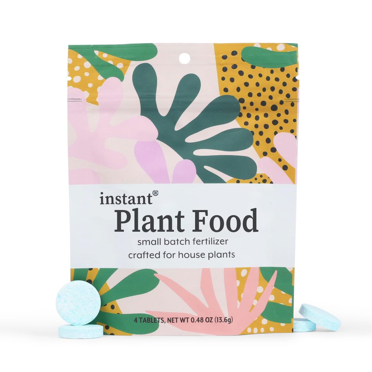 Instant Biologics tablet in water glass demonstrates easy, mess-free indoor plant feeding.