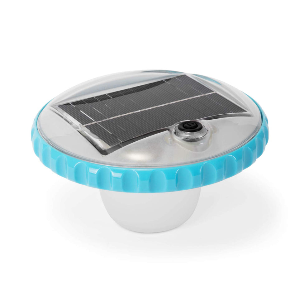 Intex 28690E solar floating light illuminating the pool at night.